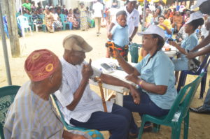 Nurses taking vital signs from patients