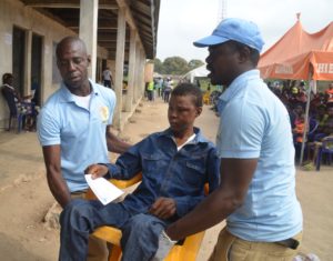 A diabetic patient being assisted to see the doctor at the Out-patients unit